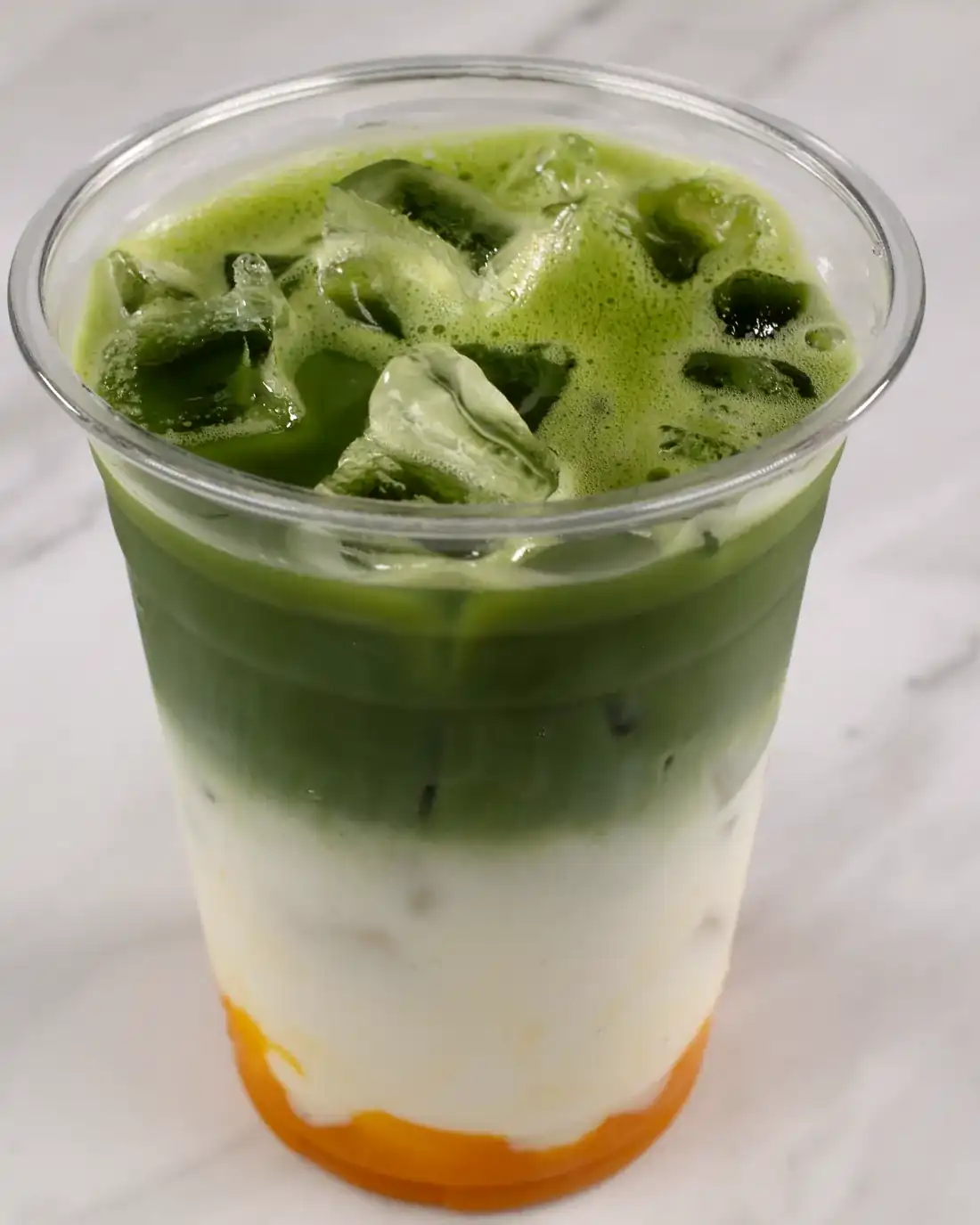 Fusion matcha at Knight & Rose Café — ceremonial matcha layered over cream and mango purée.